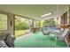 Relaxing sunroom with ample seating, skylight, and an outdoor view at 1462 S Dudley St, Lakewood, CO 80232