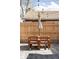 Backyard with wooden picnic table and an umbrella at 1248 Ursula St, Aurora, CO 80011