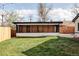 Brick pool house with white trim in a spacious backyard at 1248 Ursula St, Aurora, CO 80011