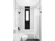 Modern bathroom with black and white tiles, shower curtain, and sleek fixtures at 1248 Ursula St, Aurora, CO 80011