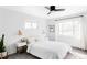 Sun-filled bedroom with modern lighting, neutral decor, and bright white walls at 1248 Ursula St, Aurora, CO 80011