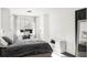 Well-lit bedroom with built-in storage, a home office area, and neutral decor at 1248 Ursula St, Aurora, CO 80011