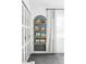 Bedroom area featuring a built in shelving unit, closet, and neutral color palette at 1248 Ursula St, Aurora, CO 80011