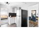Contemporary kitchen with stainless steel appliances, white cabinetry, and modern finishes at 1248 Ursula St, Aurora, CO 80011