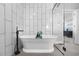 This luxurious bathroom features a soaking tub with modern fixtures and tile at 21102 E Stanford Dr, Aurora, CO 80015