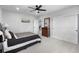 Primary bedroom with neutral carpet and a decorative wood dresser at 21102 E Stanford Dr, Aurora, CO 80015