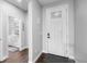 Inviting foyer with dark wood-look floors and a front door with decorative glass at 21102 E Stanford Dr, Aurora, CO 80015