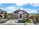 Beautiful single-Gathering home with a well-manicured lawn and a welcoming front porch at 21102 E Stanford Dr, Aurora, CO 80015