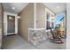 Charming front porch with stone accents, rocking chairs, and a welcoming entrance at 21102 E Stanford Dr, Aurora, CO 80015
