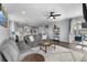 Open floor plan featuring a living area with hardwood flooring, a ceiling fan, and a view of the outdoor scenery at 21102 E Stanford Dr, Aurora, CO 80015