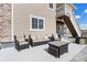 Outdoor patio with comfortable wicker furniture and an under-deck ceiling at 21102 E Stanford Dr, Aurora, CO 80015