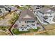 Aerial view of the rear exterior featuring a large yard and outdoor living space at 21102 E Stanford Dr, Aurora, CO 80015