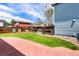Backyard features a concrete patio, lush lawn, and a privacy fence, perfect for outdoor living at 4184 Netherland St, Denver, CO 80249