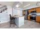 Kitchen with an island, stainless steel appliances, and light wood cabinetry at 4184 Netherland St, Denver, CO 80249