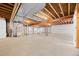Large unfinished basement ready for customization, boasting concrete floors and exposed ceiling for creative design at 21780 E Heritage Pkwy, Aurora, CO 80016