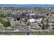 A sweeping view of a high-end community center with manicured landscaping, parking and a porte cochere at 21780 E Heritage Pkwy, Aurora, CO 80016