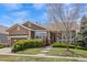 Charming single-Gathering home with well-manicured lawn, a welcoming porch, and an attached two-car garage at 21780 E Heritage Pkwy, Aurora, CO 80016