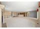 Open concept living room with a fireplace, stairs, and combined kitchen with breakfast bar at 21780 E Heritage Pkwy, Aurora, CO 80016