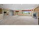 Spacious living room with a fireplace, large windows, and neutral carpet at 21780 E Heritage Pkwy, Aurora, CO 80016