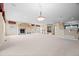 Large living room with an open floor plan, fireplace, and bar, perfect for entertaining and relaxation at 21780 E Heritage Pkwy, Aurora, CO 80016