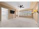 Spacious main bedroom featuring neutral carpet, tray ceilings and shuttered windows at 21780 E Heritage Pkwy, Aurora, CO 80016
