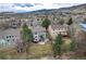 A charming backyard with a patio area on a multi-story home in a quiet neighborhood surrounded by lush greenery at 49 Dawn Heath Cir, Littleton, CO 80127