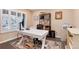 Well-lit home office space with large window and comfortable work area, perfect for remote work at 49 Dawn Heath Cir, Littleton, CO 80127