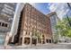 Brick building in downtown area featuring storefronts and detailed architectural elements at 444 17Th St # 304, Denver, CO 80202