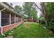 Yard with brick wall and green grass area at 9233 W Virginia Dr, Lakewood, CO 80226