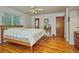 Spacious bedroom featuring hardwood floors and ample natural light at 9233 W Virginia Dr, Lakewood, CO 80226