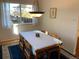 Cozy dining room with hardwood floors and a large window at 9233 W Virginia Dr, Lakewood, CO 80226