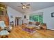 Bright living room with hardwood floors and ample natural light at 9233 W Virginia Dr, Lakewood, CO 80226