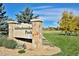 Addenbrooke Park entrance sign with beautiful landscaping at 9233 W Virginia Dr, Lakewood, CO 80226