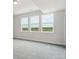 Spacious room featuring a wall of windows offering picturesque views at 4716 Twelve Oaks Way, Castle Rock, CO 80104