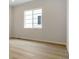 Light-filled room with wood floor and a large window with views at 4716 Twelve Oaks Way, Castle Rock, CO 80104