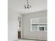 Open dining area featuring contemporary chandelier and large window for natural light at 4716 Twelve Oaks Way, Castle Rock, CO 80104