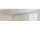 Bright room featuring a large window and neutral-toned walls at 4716 Twelve Oaks Way, Castle Rock, CO 80104