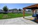 Backyard featuring green lawn, privacy fence, patio area with pergola, and swing set at 11158 Carbondale St, Firestone, CO 80504