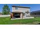 Backyard featuring green lawn, privacy fence, patio area with pergola at 11158 Carbondale St, Firestone, CO 80504