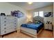 Cozy bedroom with sports memorabilia and a coordinating bed set at 11158 Carbondale St, Firestone, CO 80504