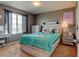 Comfortable bedroom with a large window and bright, natural light at 11158 Carbondale St, Firestone, CO 80504