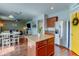 Open kitchen and living area showcasing modern appliances, an island, and comfortable seating at 11158 Carbondale St, Firestone, CO 80504