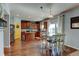 Modern kitchen with stainless appliances, an island, and a dining area, perfect for Gathering meals at 11158 Carbondale St, Firestone, CO 80504