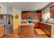 Stylish kitchen featuring stainless steel appliances, granite countertops, and a functional island at 11158 Carbondale St, Firestone, CO 80504