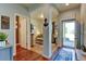 Open concept living room with a fireplace and seamless flow into the home's entryway at 11158 Carbondale St, Firestone, CO 80504