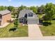 Aerial view of a delightful home with a spacious yard and mature trees at 21351 E Williamette Pl, Centennial, CO 80015