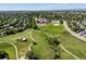 Aerial image of a neighborhood with a park, walking trails, and open green space near residential streets at 21351 E Williamette Pl, Centennial, CO 80015