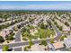 Aerial view of a residential area featuring a park and playground, surrounded by well-maintained homes and green spaces at 21351 E Williamette Pl, Centennial, CO 80015