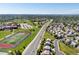 Expansive aerial view showcasing a residential neighborhood next to a school and athletic fields at 21351 E Williamette Pl, Centennial, CO 80015