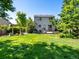 Large, well-maintained backyard features a patio, pergola, and lush green lawn for outdoor enjoyment at 21351 E Williamette Pl, Centennial, CO 80015